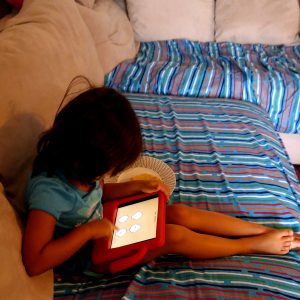 ooka island, kids reading on ipad