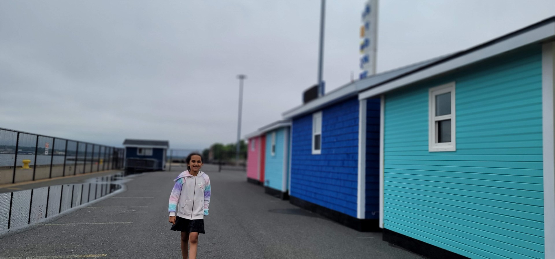 girl walking by Sydney's colourful containers