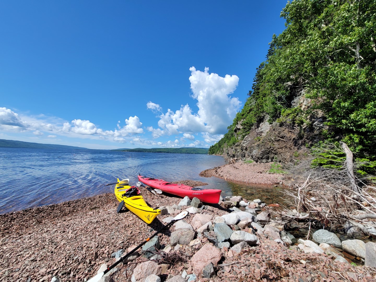 kayaks in Cape Breton on a sunny blue skies day