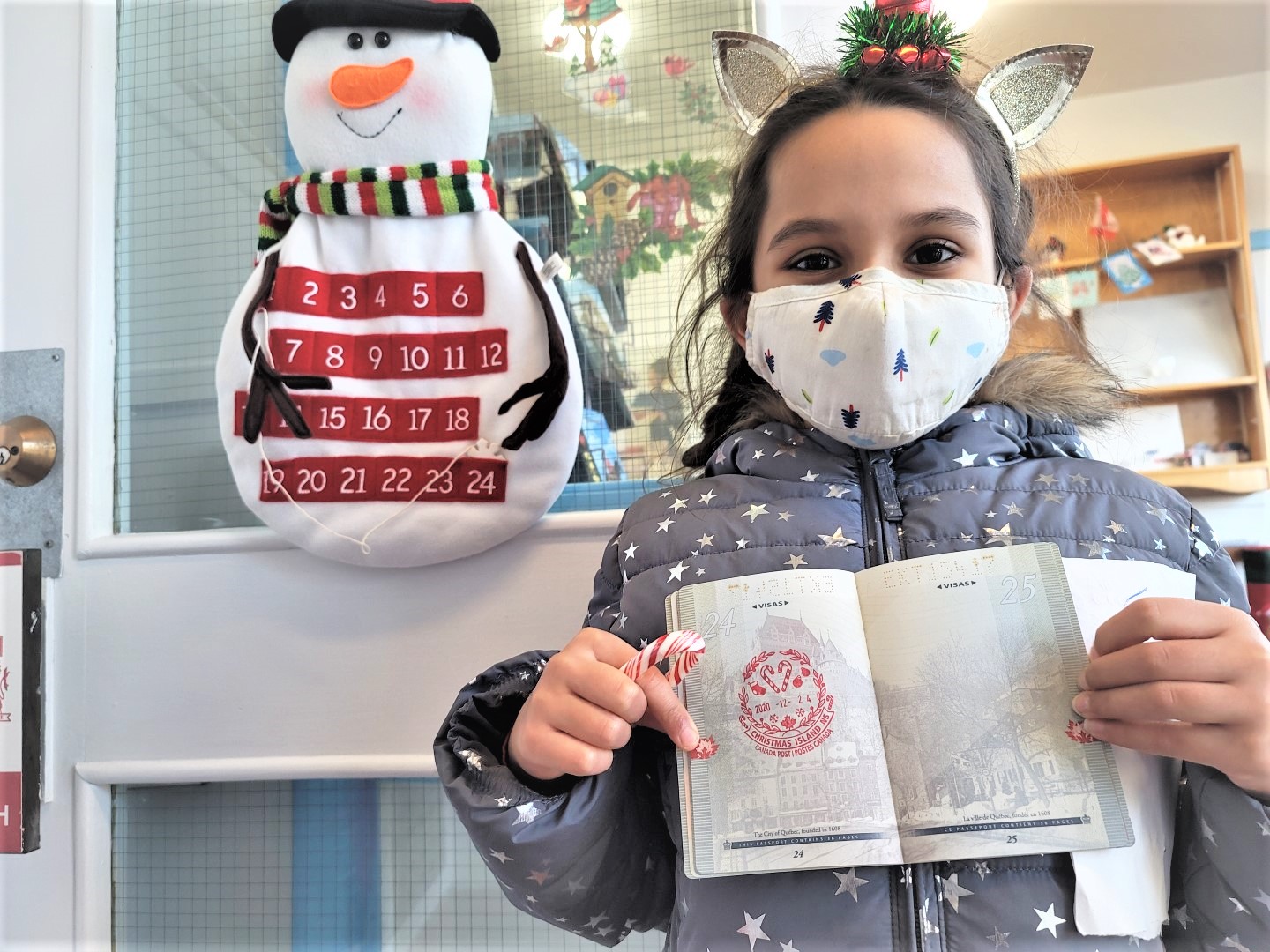 masked girl holding Christmas Island NS stamped passport