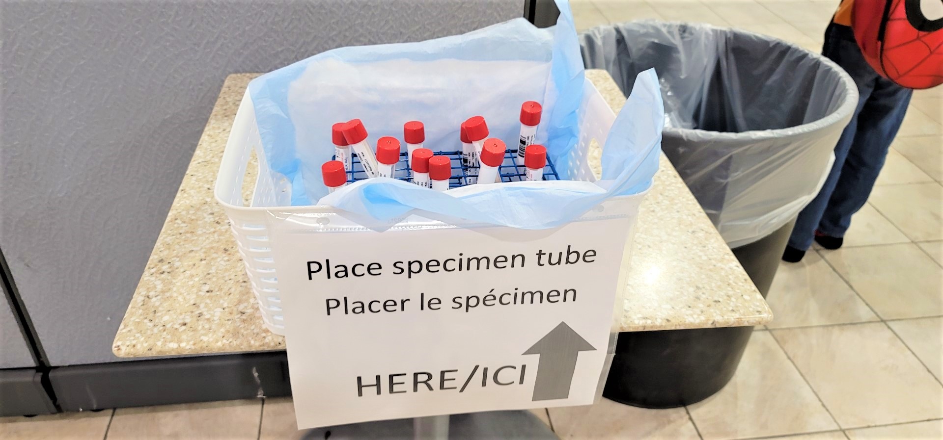 covid test red lid tubes in specimen bin