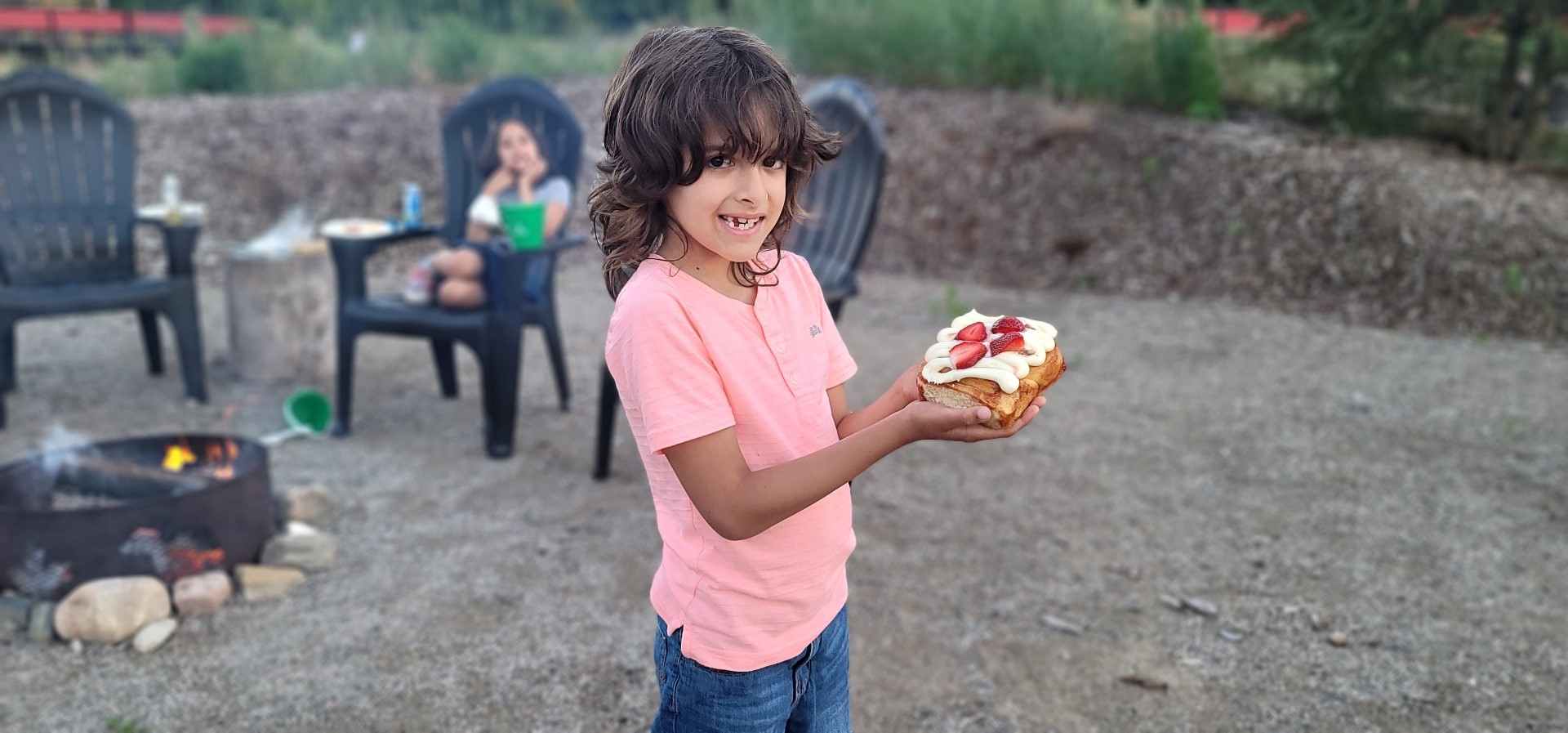 boy holding strawberry Cinnabon