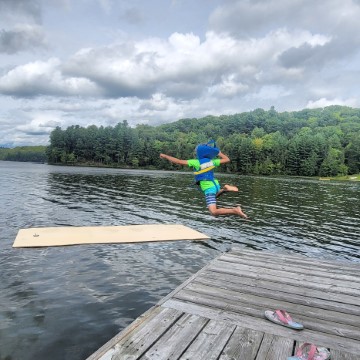 kids in life jacket jumping into lake in Bracebridge