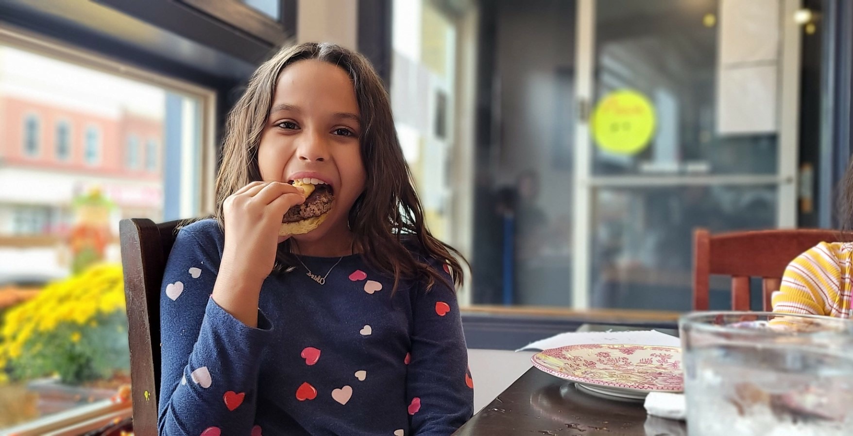 girl eating in Perth County restaurant