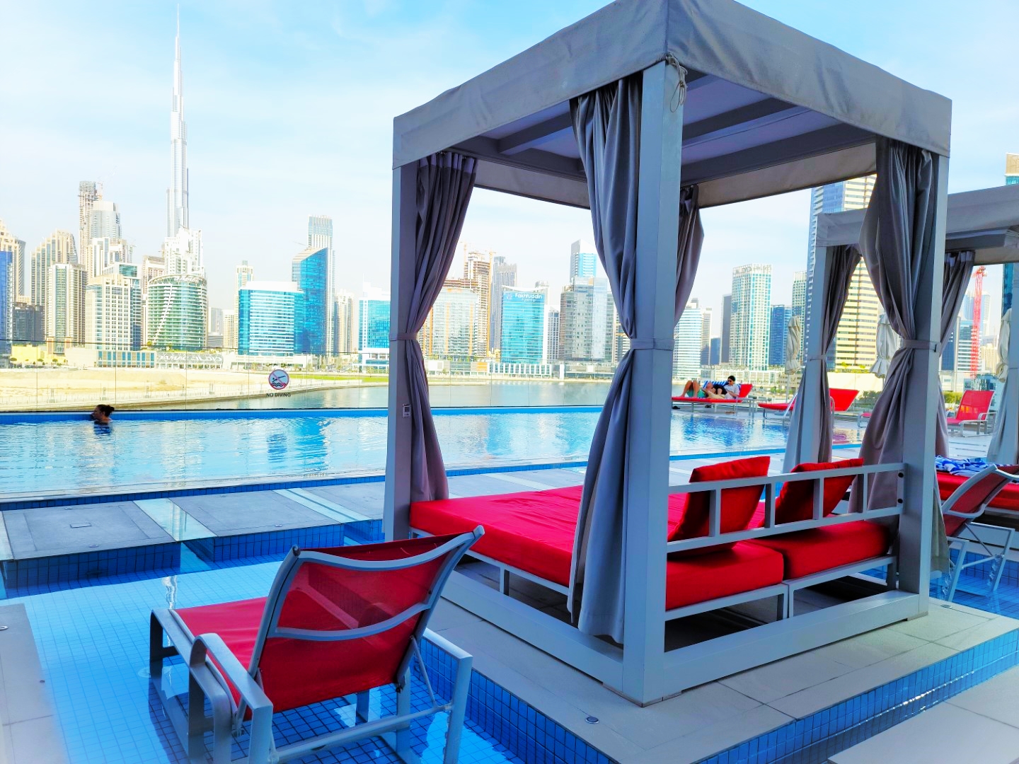 pool cabana with dubai skyscrapers in background