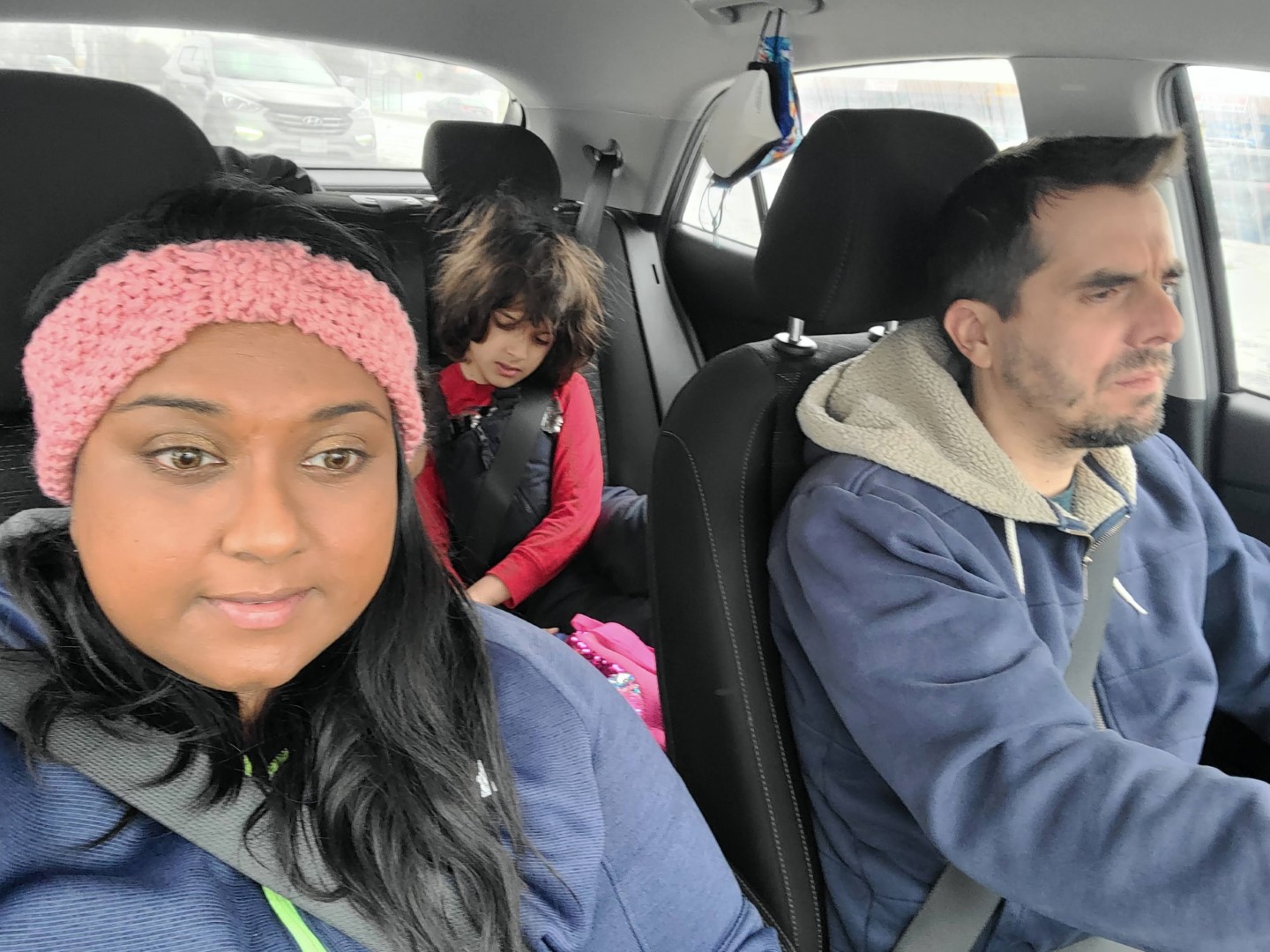 Yashy and Chris Murphy in car with child