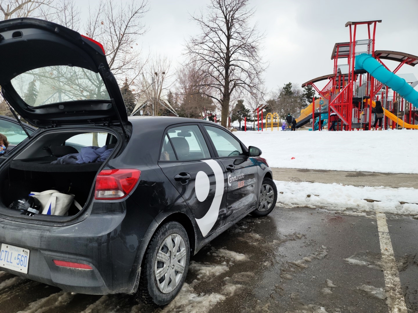 Communauto car share with trunk open in snow