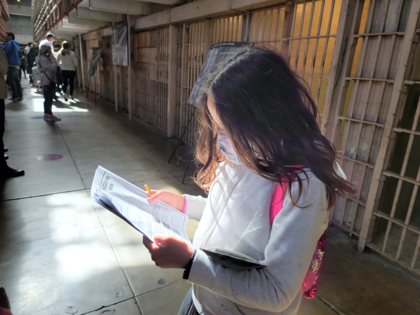 kid looking at activity book inside Alcatraz