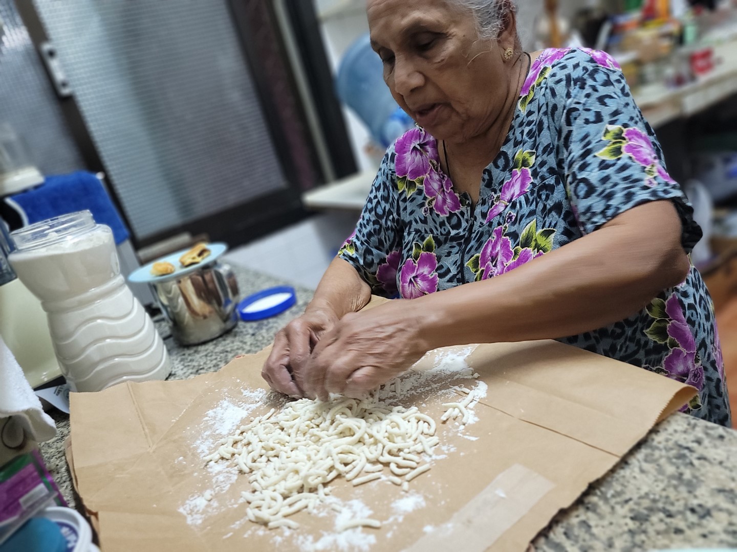 Sri Lankan grandmother cooking manipittu