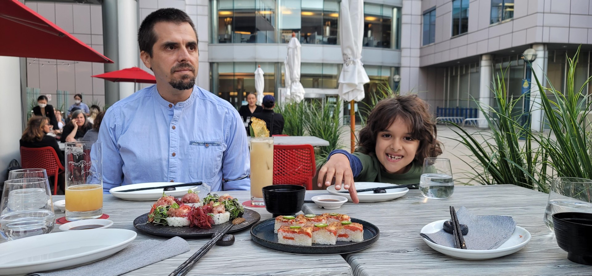 DAD AND son eating sushi in Toronto