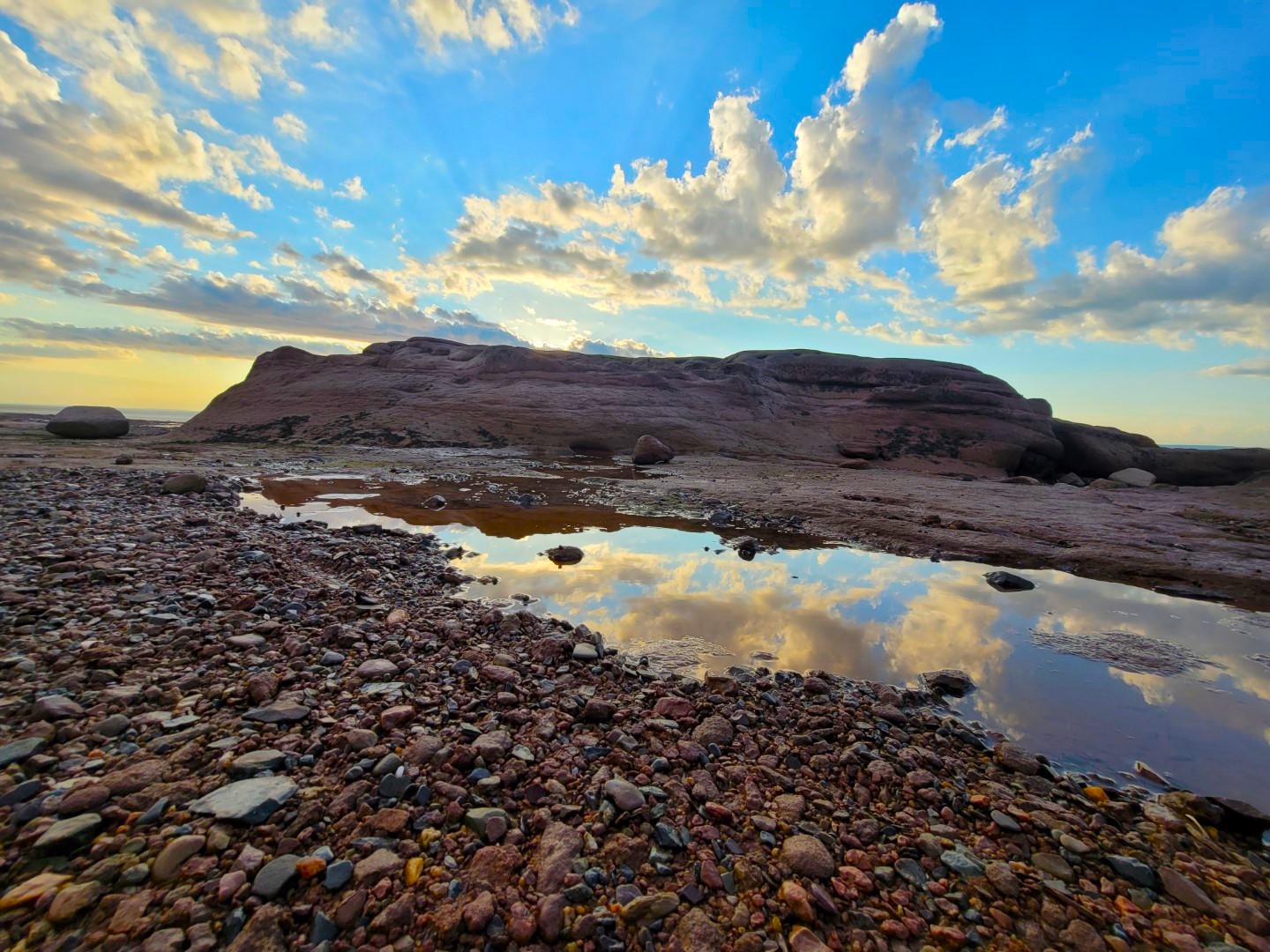 reflections of blue sky and white clouds at Burntcoat head park