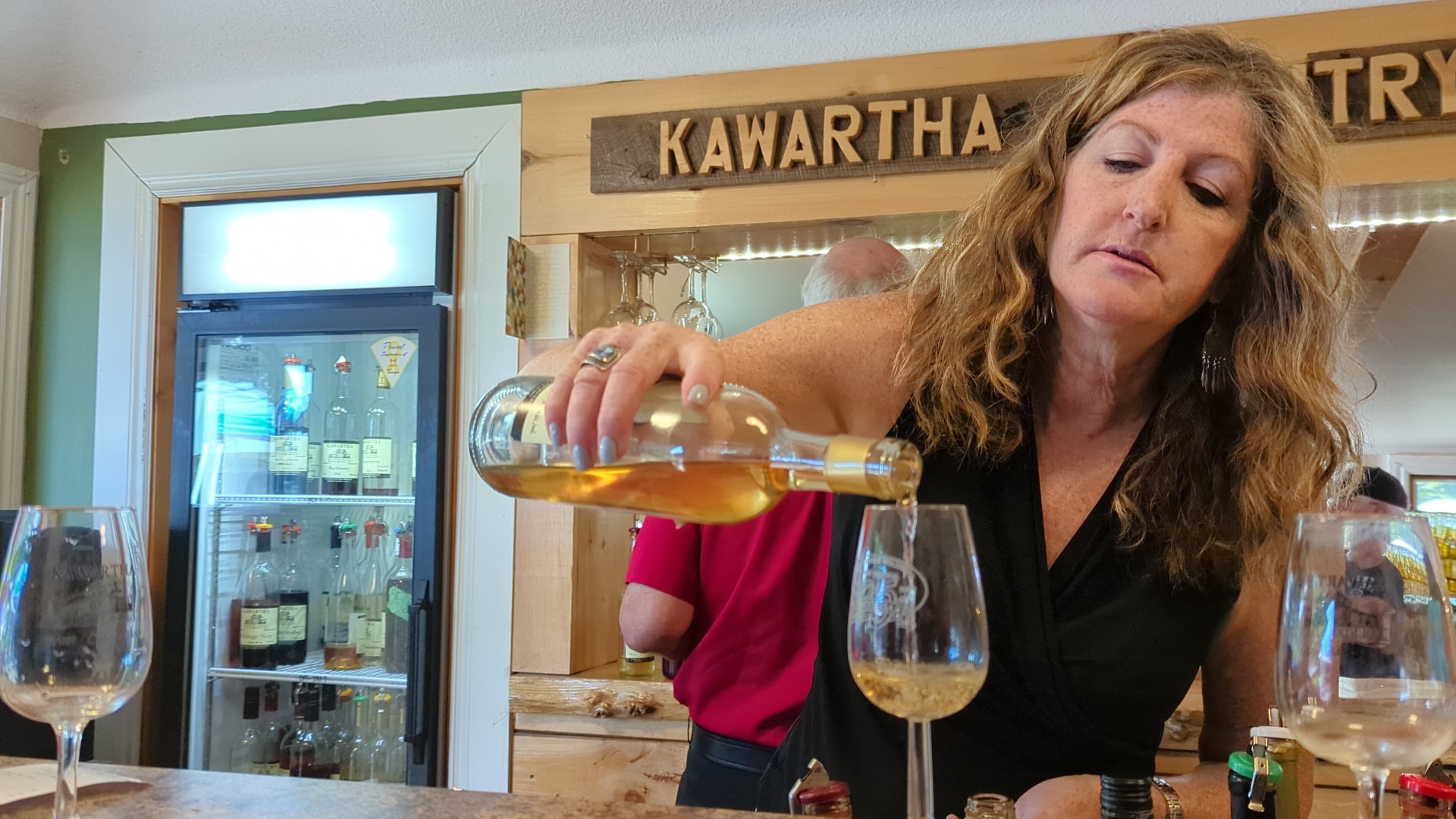 woman pouring Kawartha Country Wine