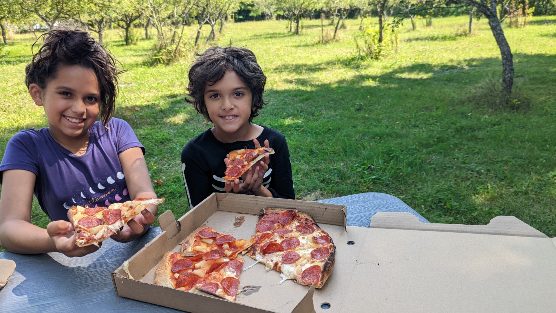kids eating pizza in winery