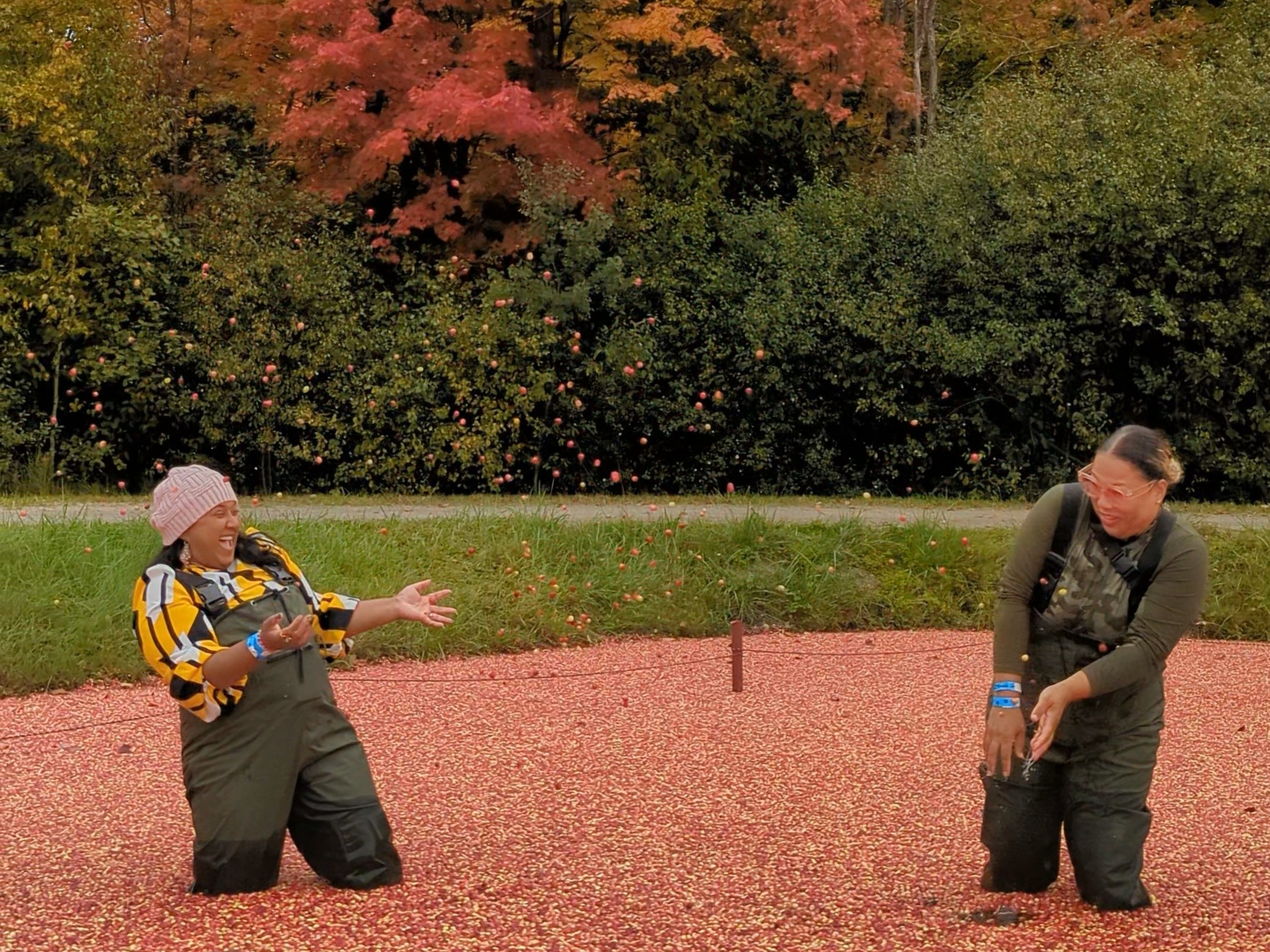 Yashy and friend throwing cranberries