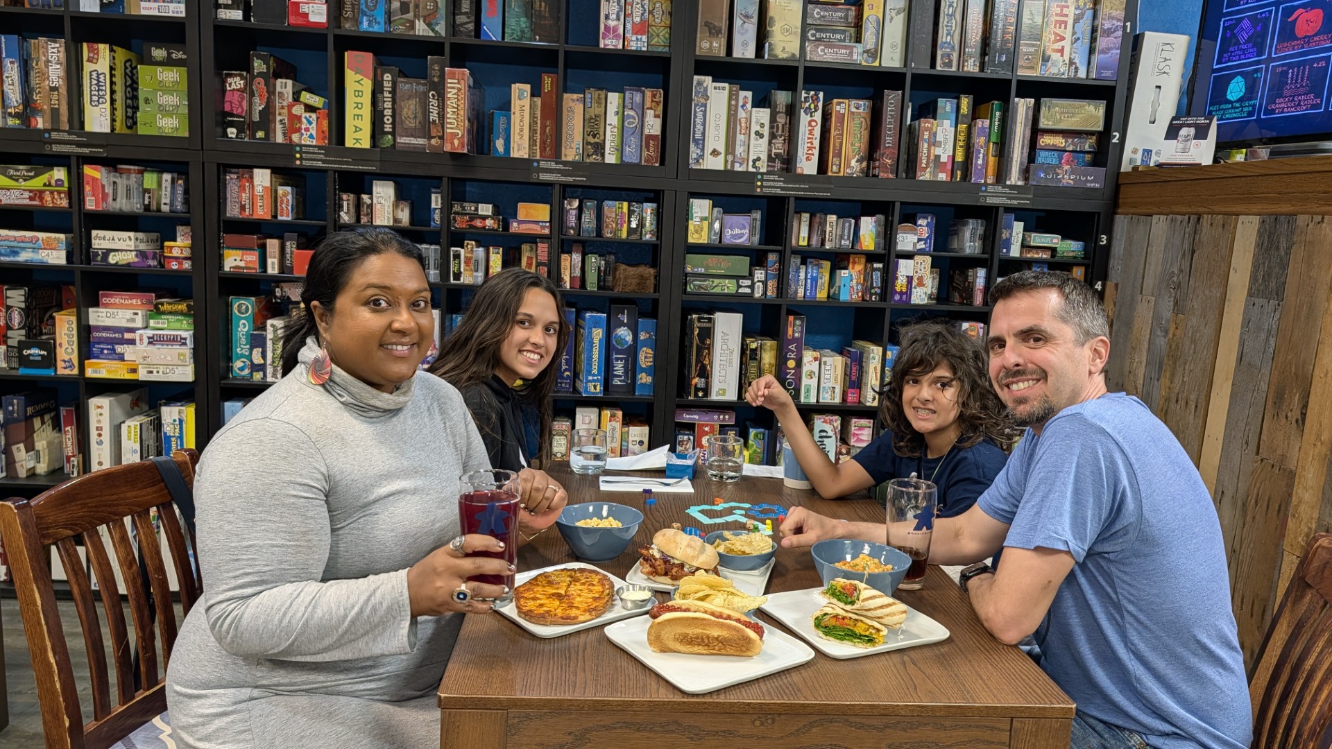 Yashy and family playing games at Peterborough cafe
