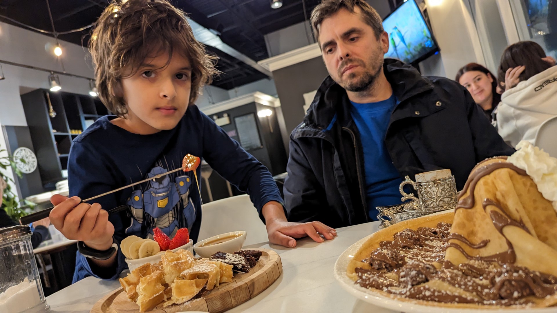 boy holding waffle fondue