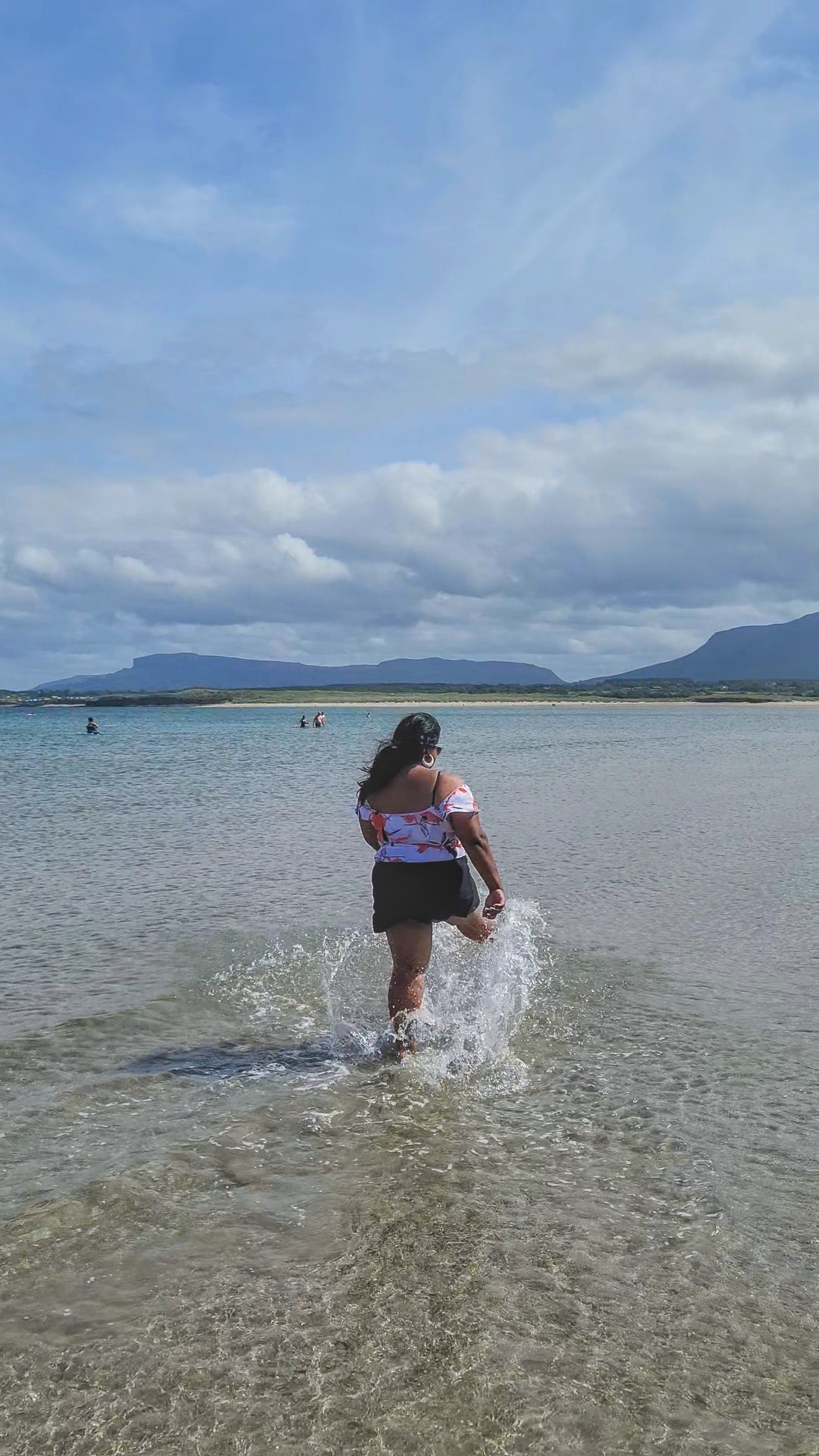 yashy splashing at a beach in Ireland