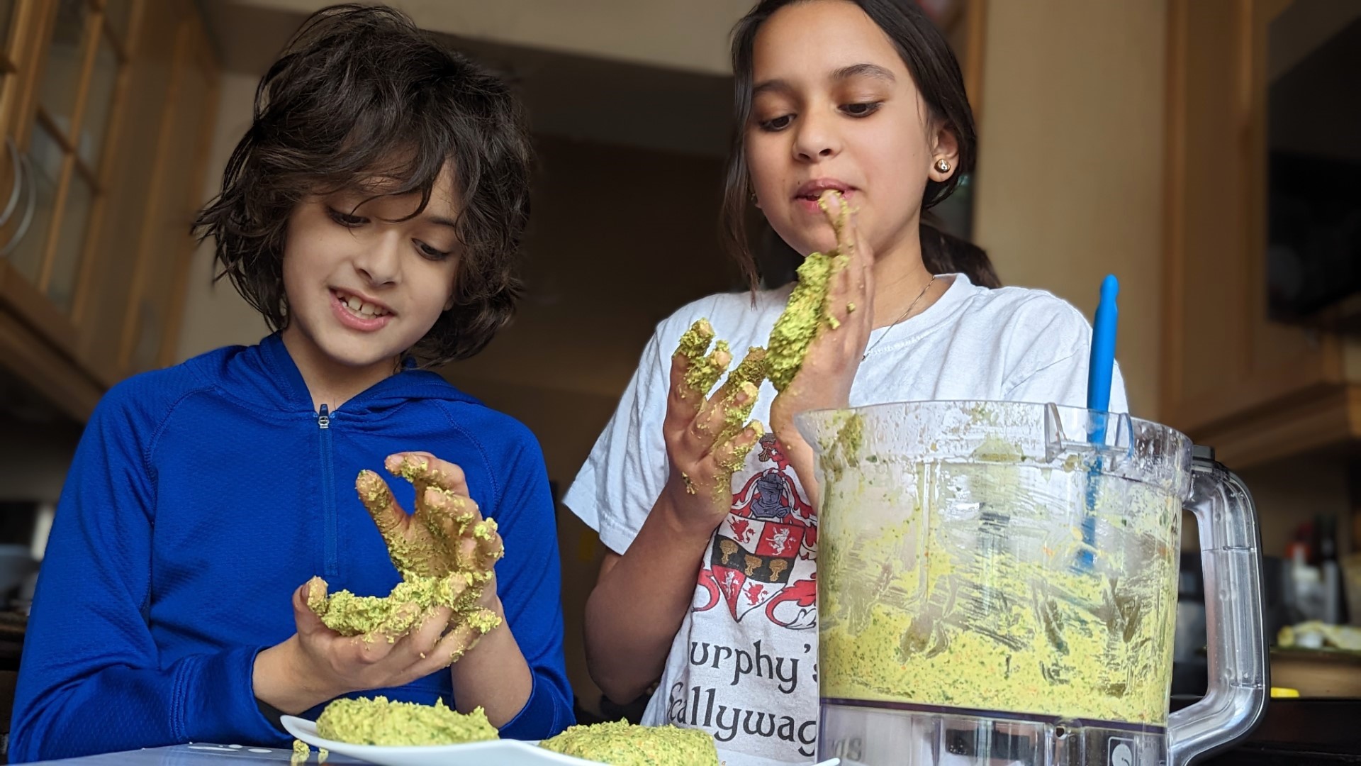 Kids making falafel burger recipe