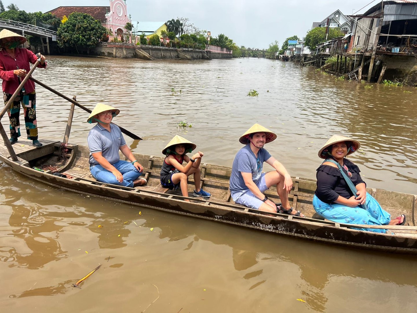 Family on a boat in the Mekong Delta