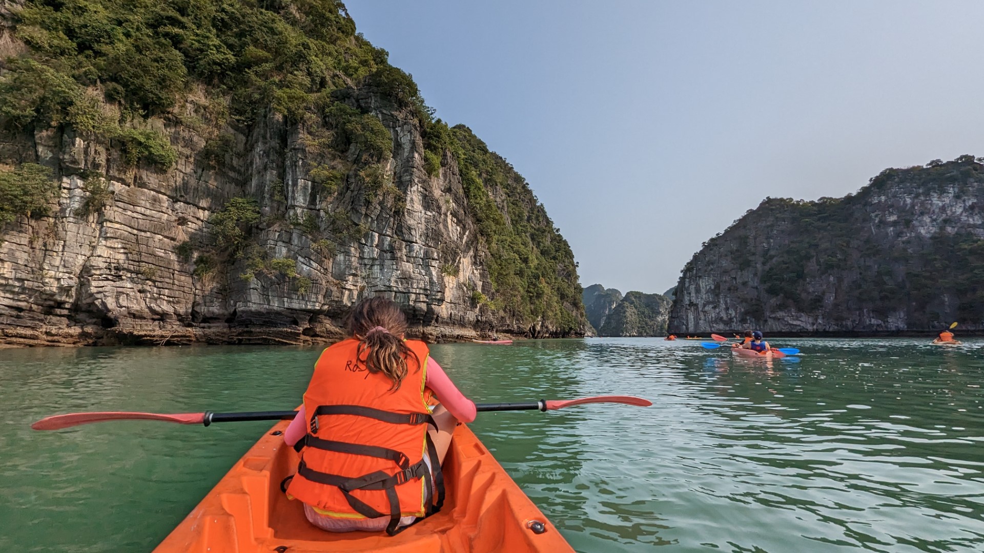 girl rowing in Halong bay Vietnam