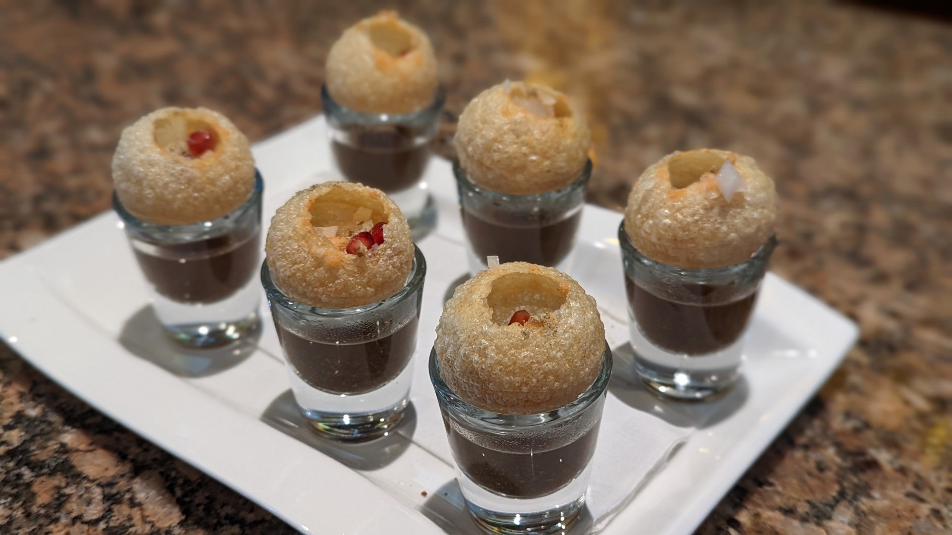 pani puri vodka shots at Aura on the Lake Indian food