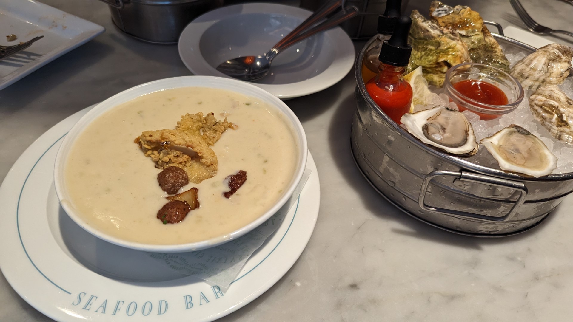 Chowder and oysters on a table