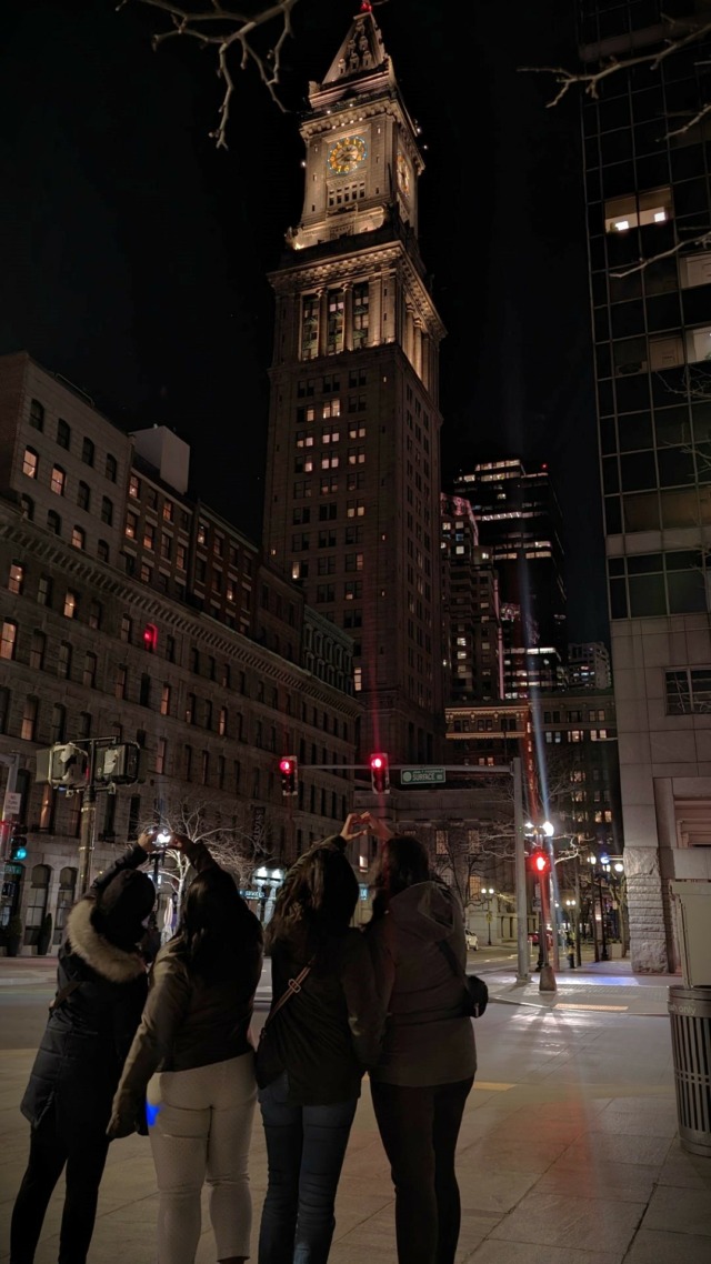 ladies holding each other on a Boston Street Corner