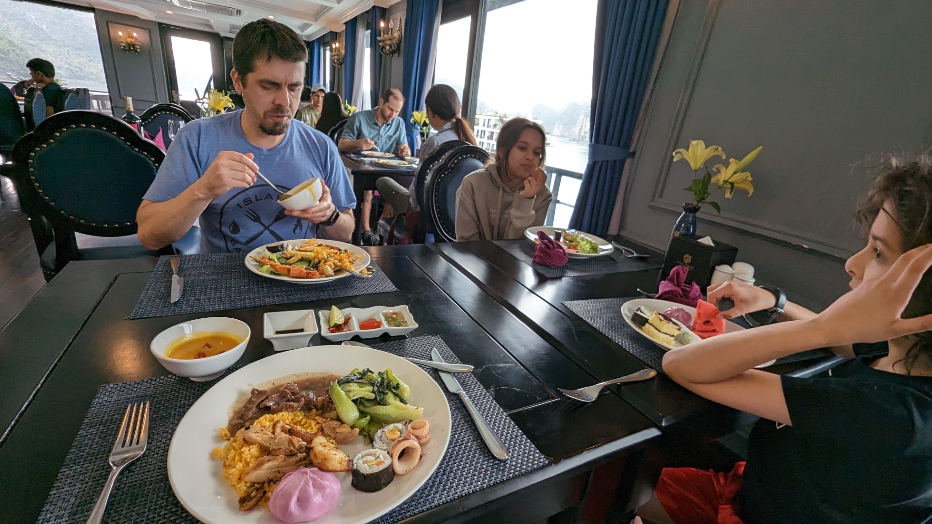 family eating on Rosy Cruise boat vietnam