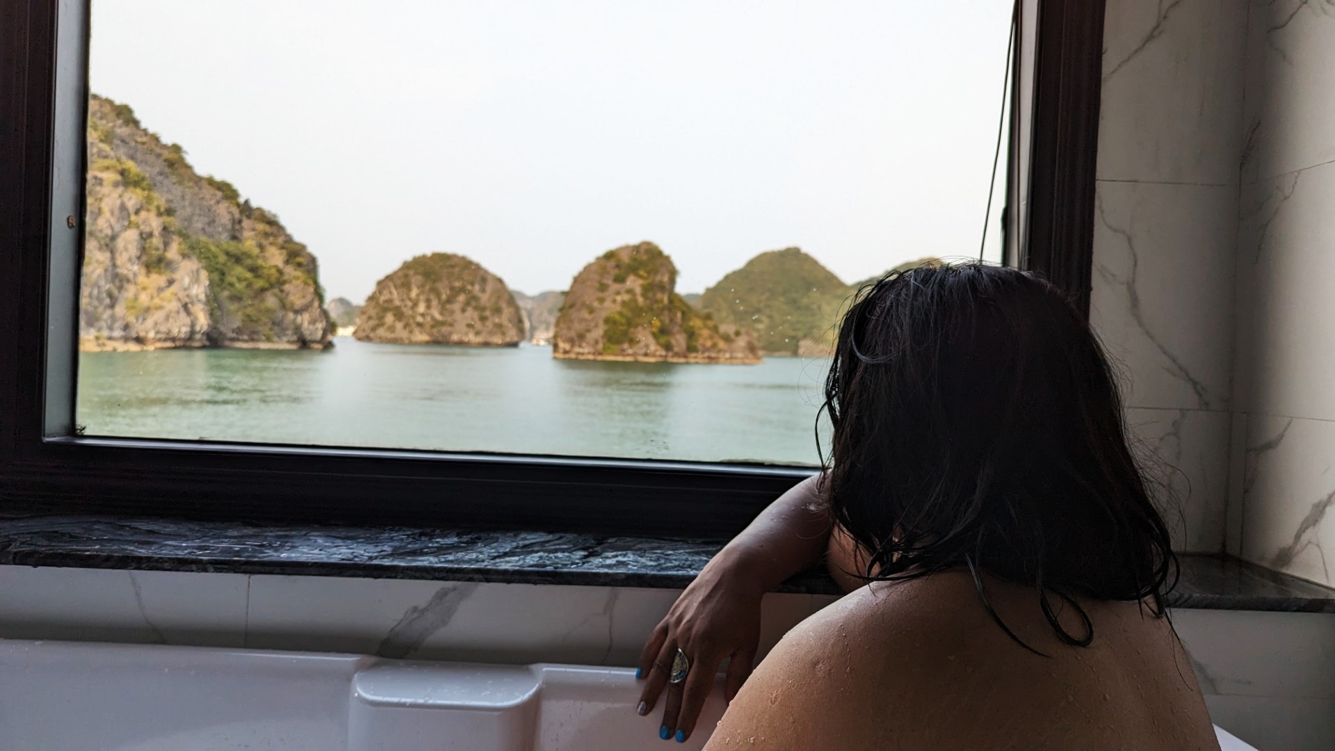 Yashy looking at Vietnam cruise window