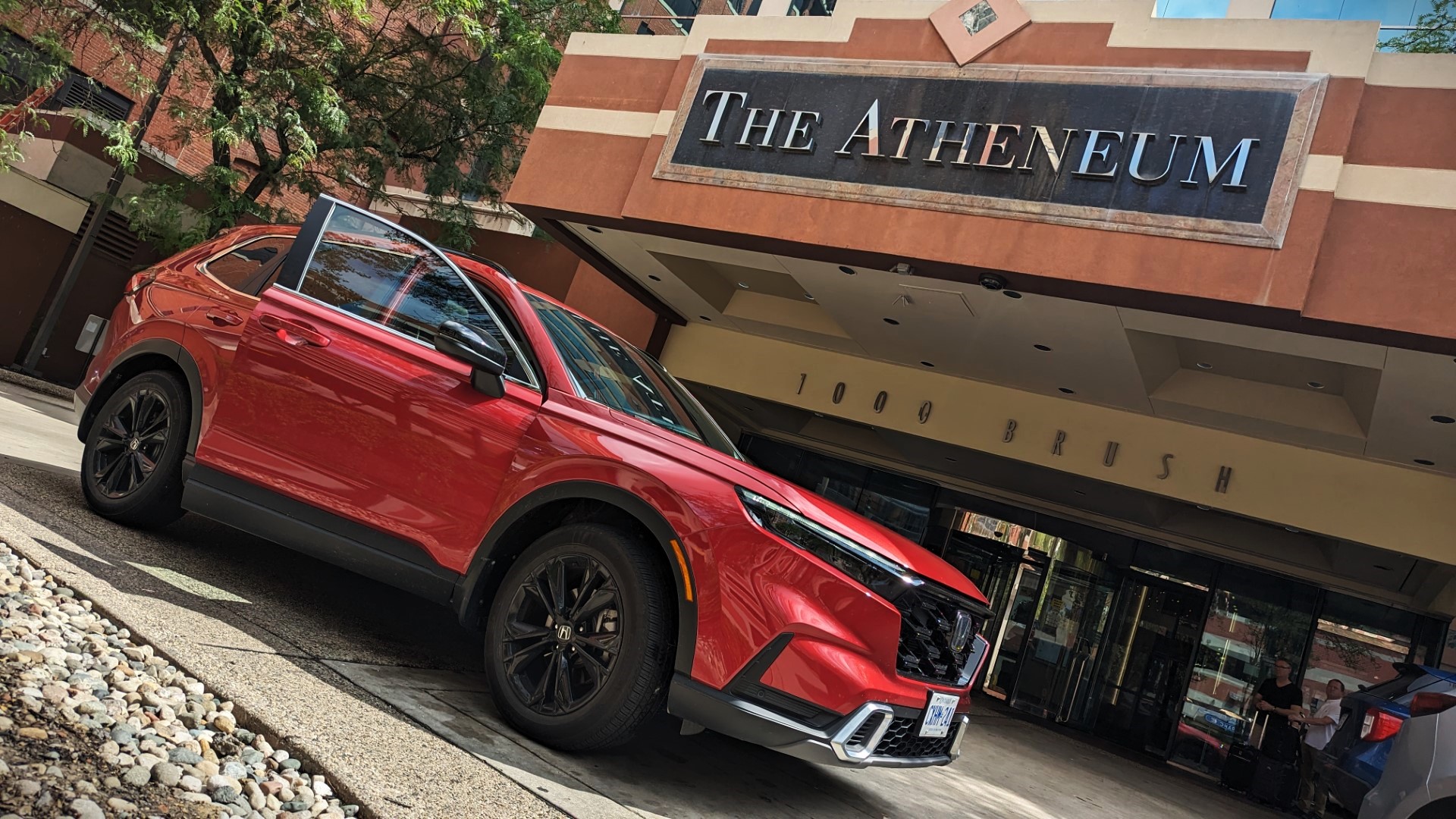 Honda Touring 2023 in front on Atheneum Hotel