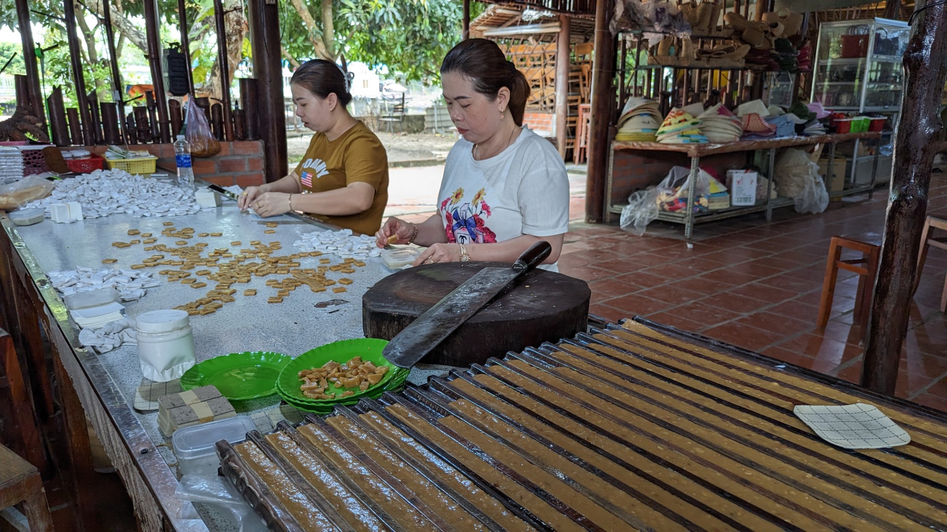 ladies making coconut candy in mekong Delta