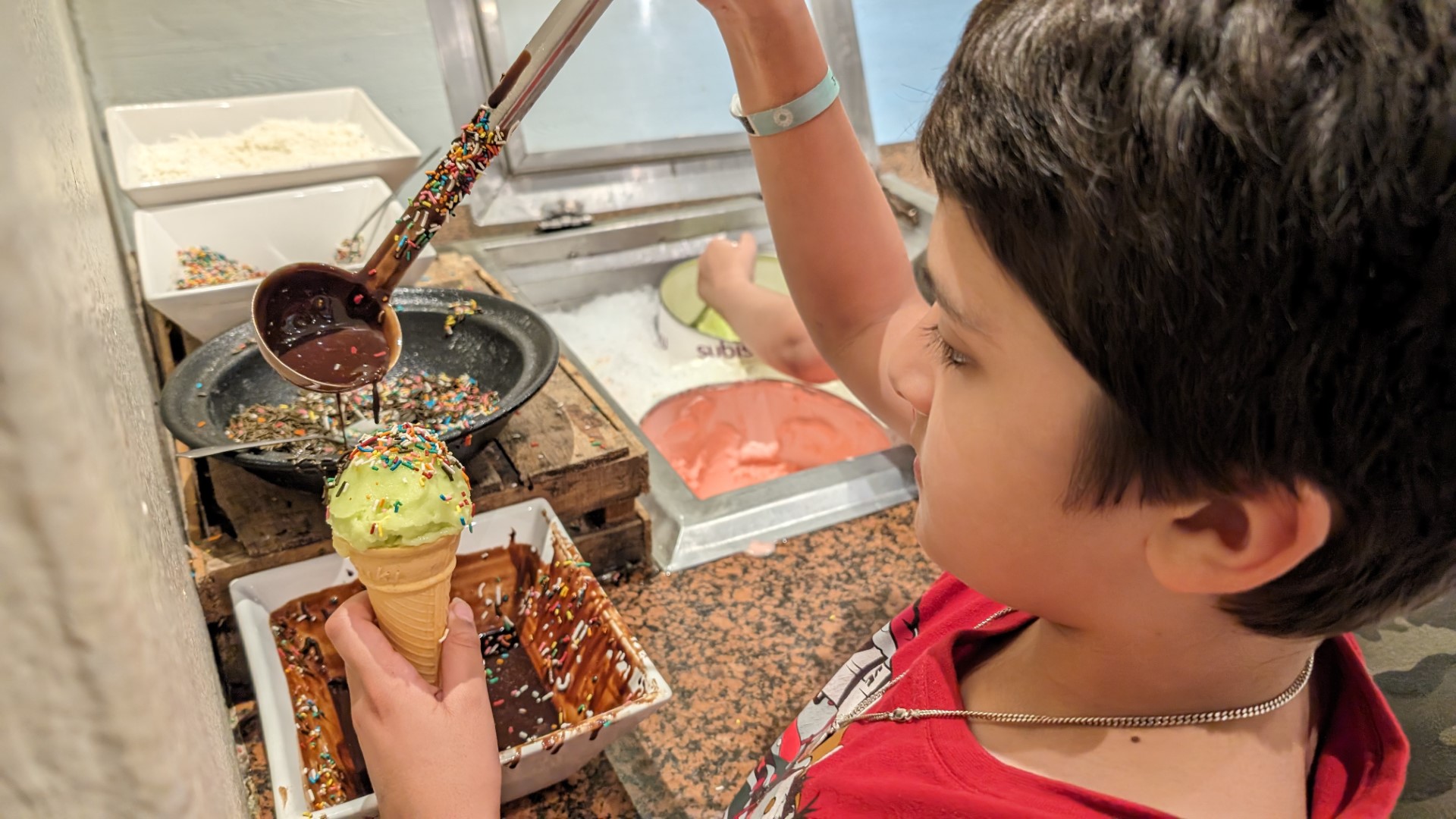 boy serving ice cream at Sandos Caracol