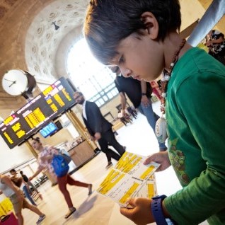 child looking at VIA Rail tickets