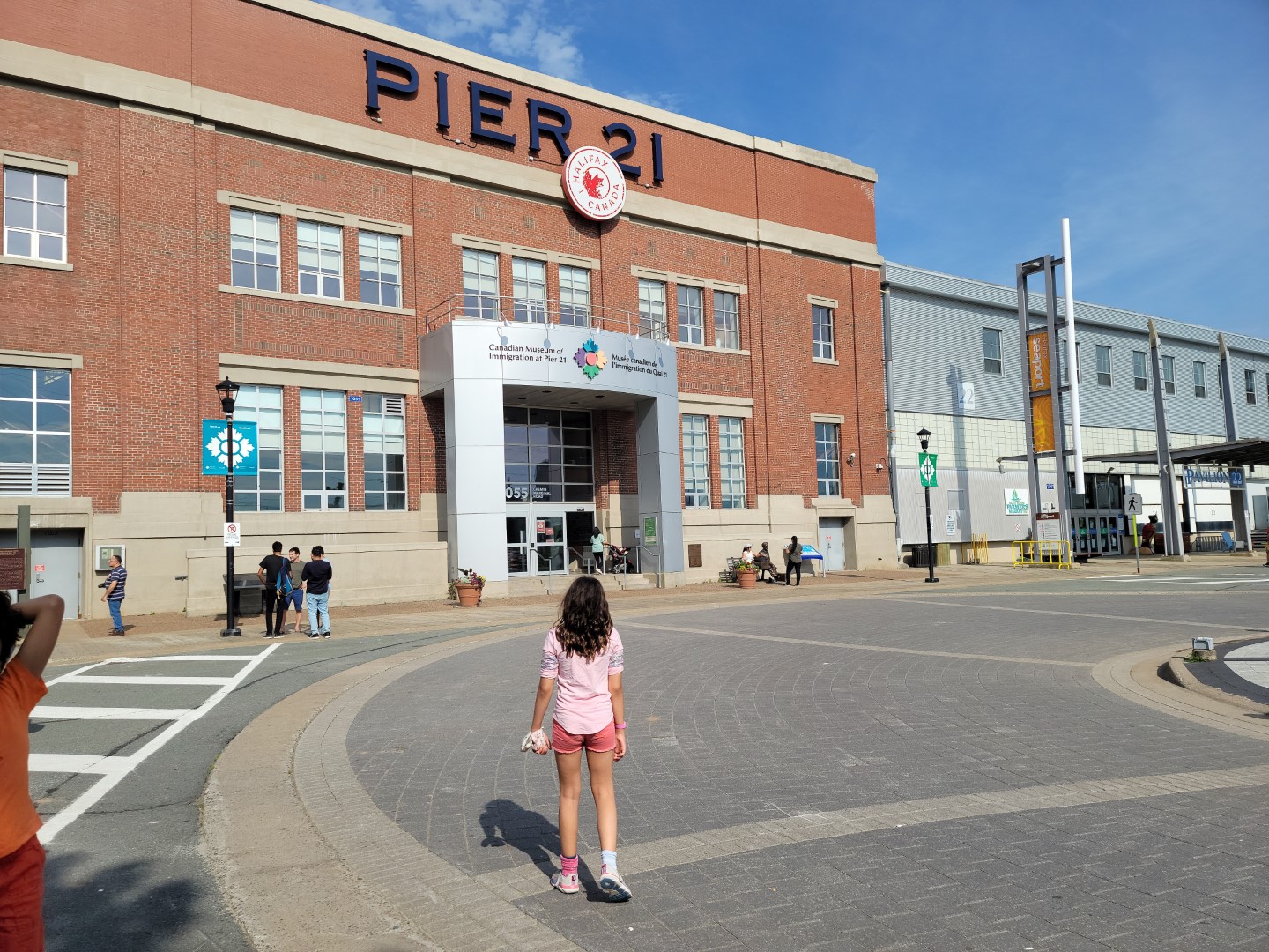 pier 21 building with child walking into it