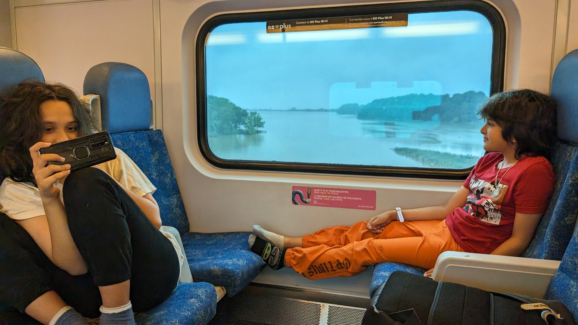 kids on Go Train from Toronto to Niagara Falls