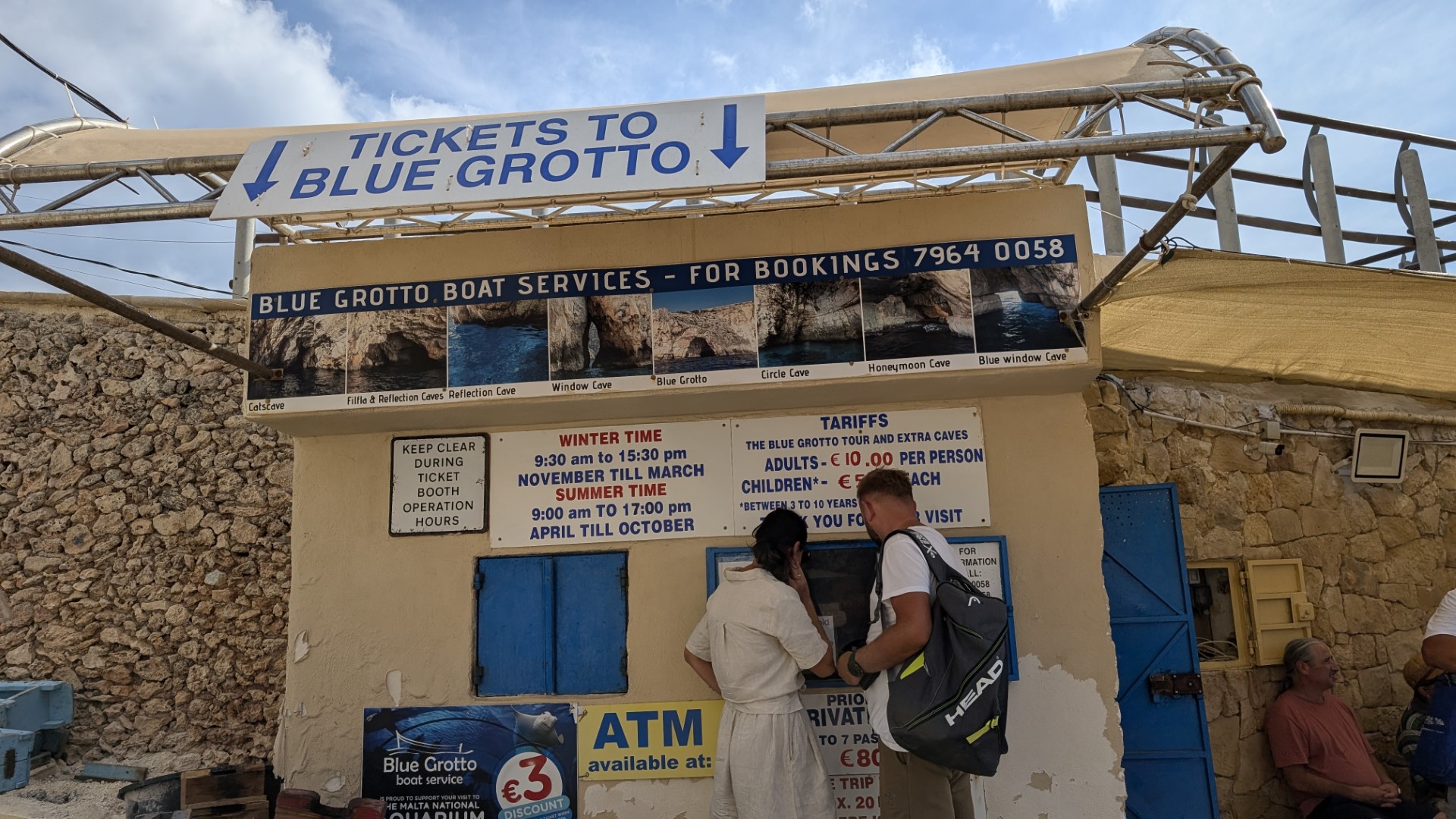 blue grotto ticket booth with people