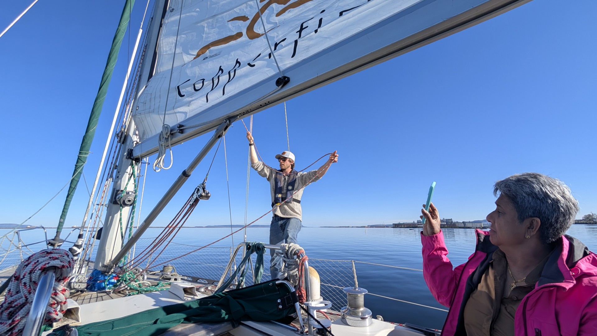 taking photos on a boat in Thunder Bay
