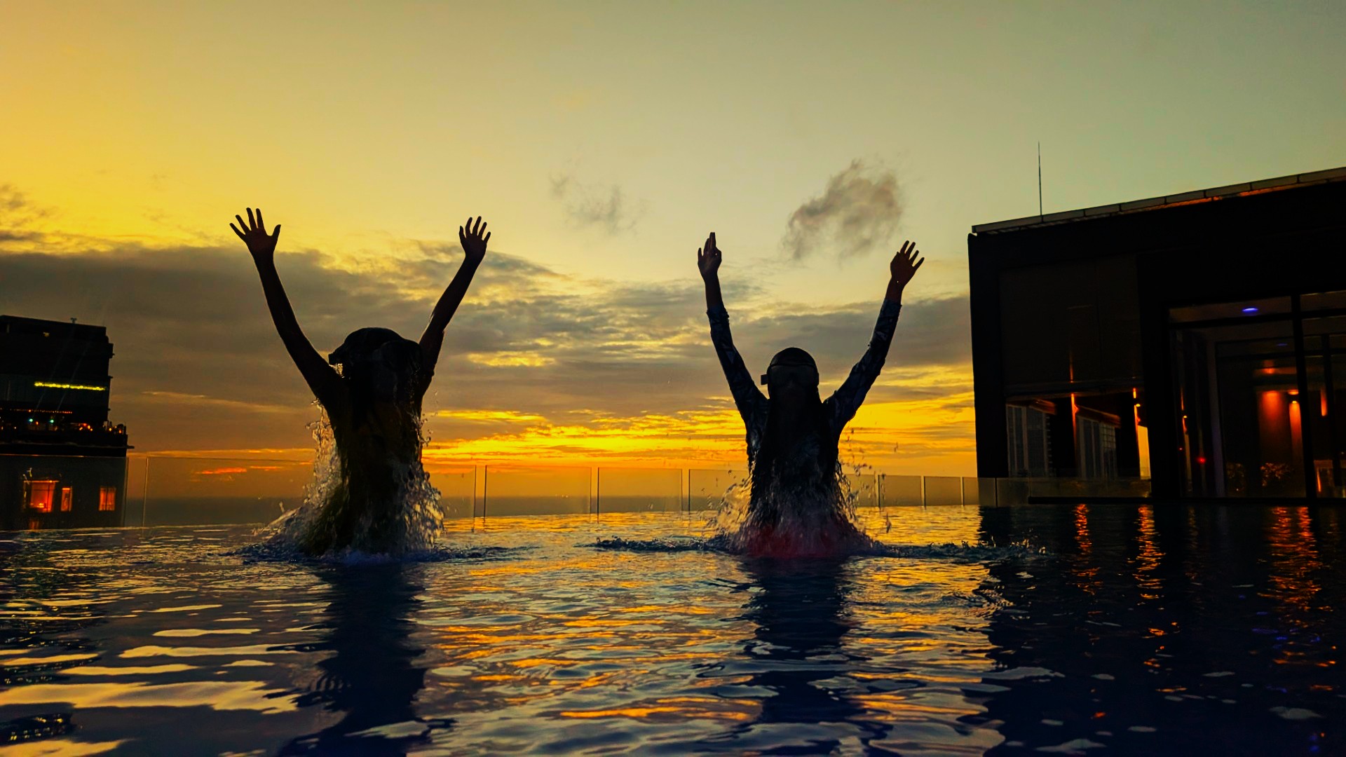 kids in pool at sunset in Colombo