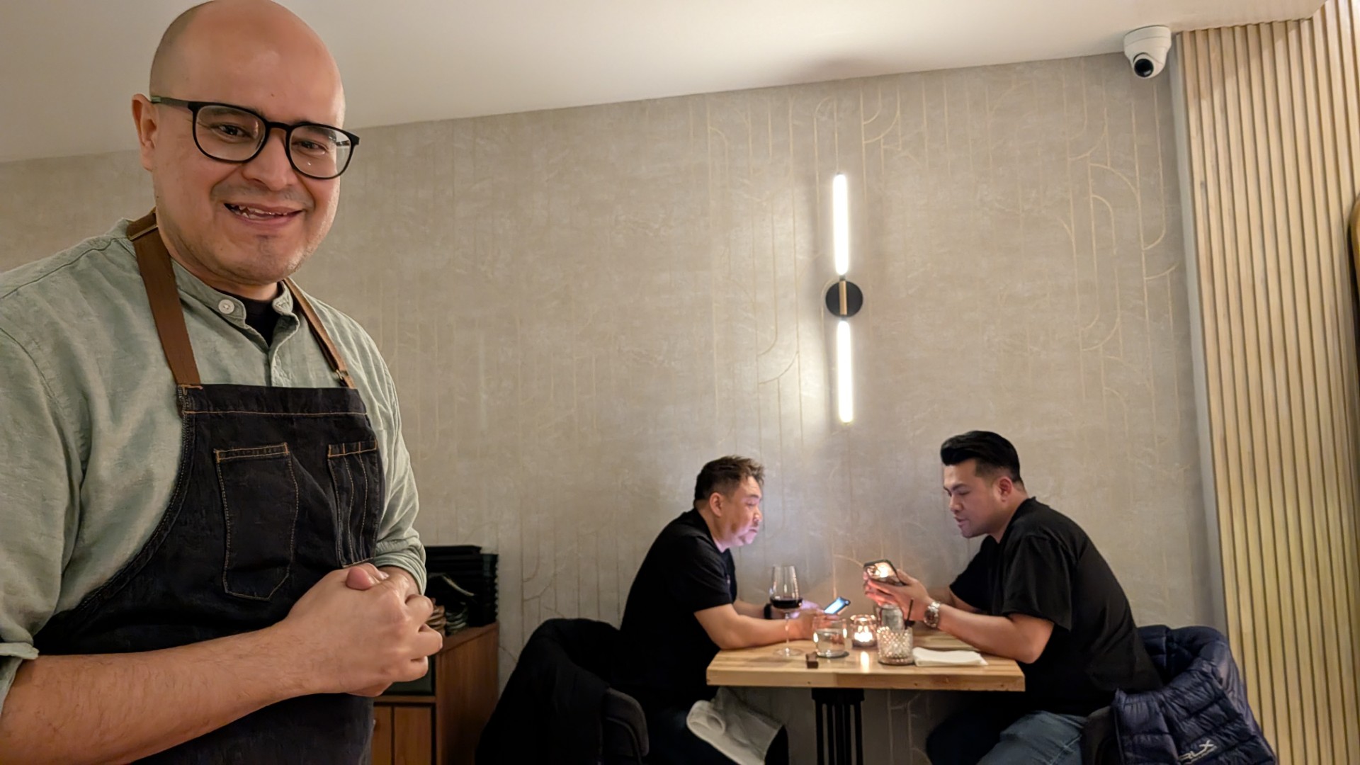 chef garcia at Ficoa tasting menu course at table